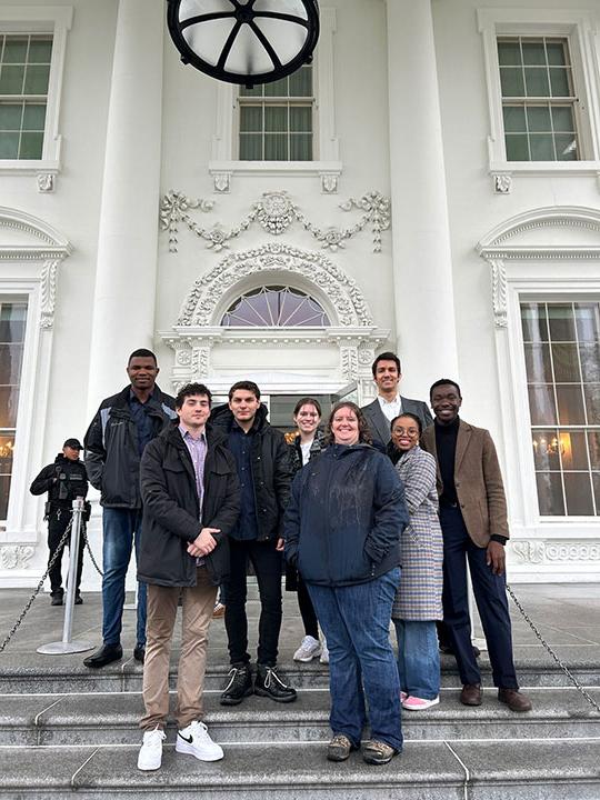 group of people standing in front of building